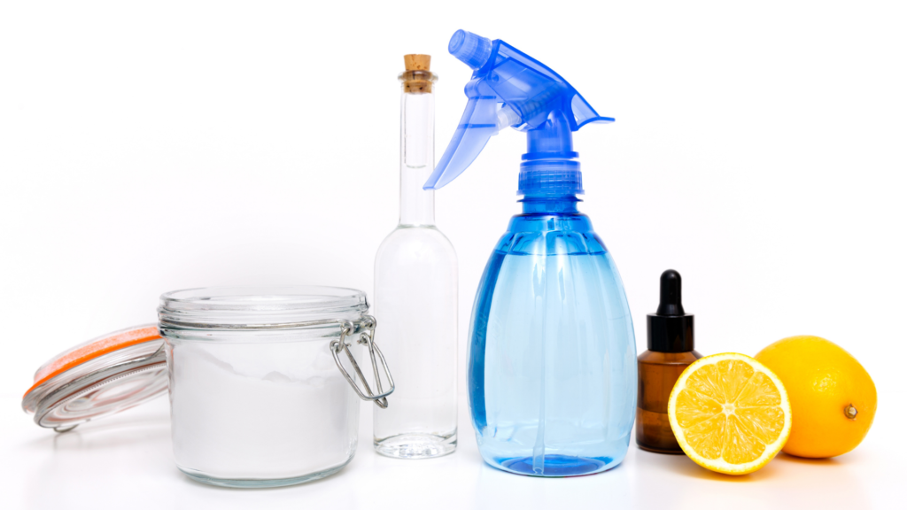 Homemade cleaning products in a spray bottle, corked bottle, jar and dropper bottle