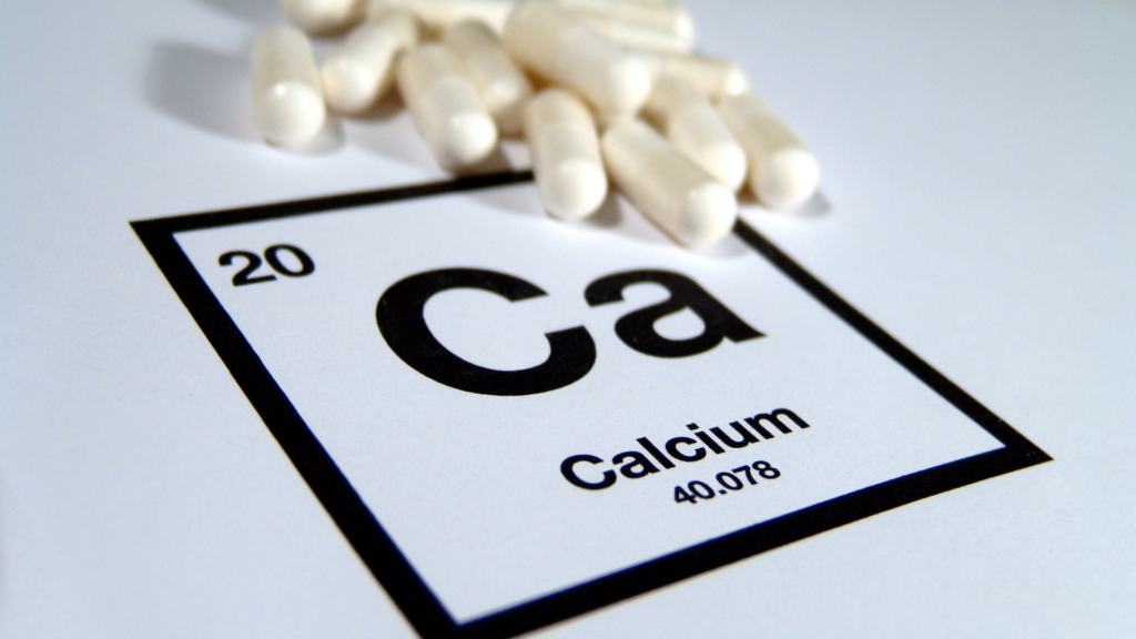 Calcium periodic table symbol with white capsules 